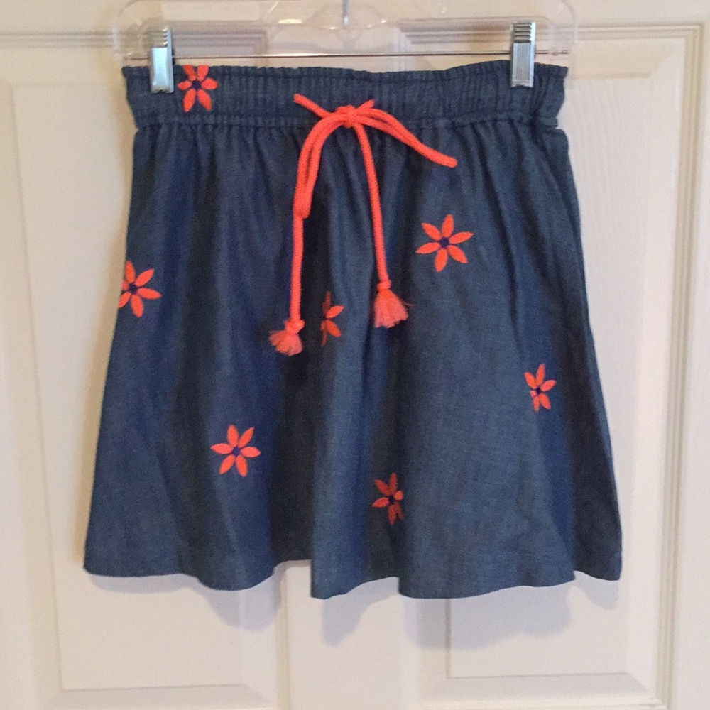 Denim skirt with sherbet embroidered flowers